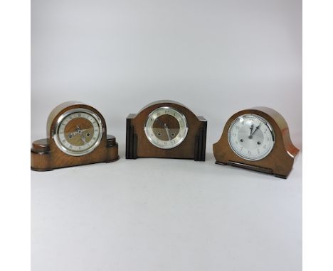 A 1930's walnut cased mantel clock, together with two others, tallest 21cm