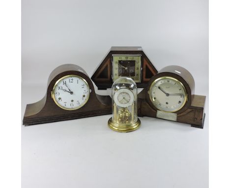 An anniversary clock, contained under a glass dome, 22cm tall, together with three various 1930's mantel clocks