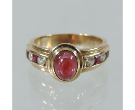 An 18 carat gold ruby cabochon and diamond ring