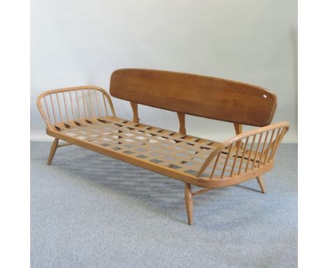 An Ercol light elm day bed, 208cm