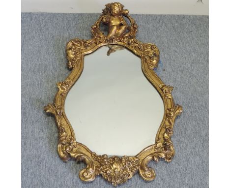 A 19th century gilt gesso cartouche wall mirror, with putti finial, 100 x 64cm