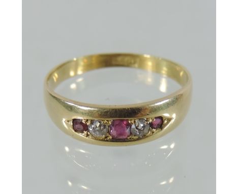 An 18 carat gold ruby and diamond five stone ring