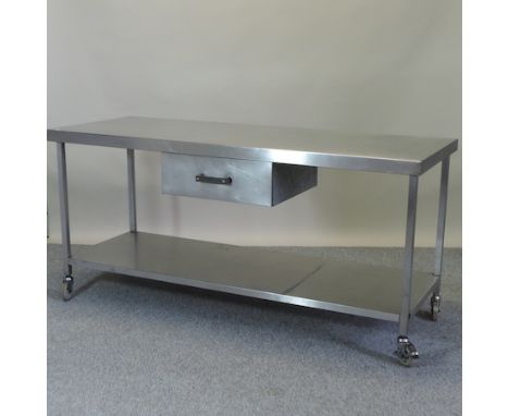 A stainless steel work table, with a single drawer and pot shelf below, 180cm