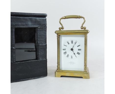 An early 20th century brass carriage clock, by Mappin and Webb, in a fitted case, 15cm tall