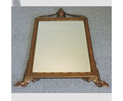 A Victorian carved and parcel gilt wall mirror, surmounted by an urn, 122 x 95cm