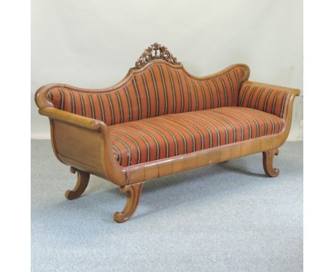 A 19th century carved walnut and striped upholstered scroll end sofa, on sabre legs, 220cm 