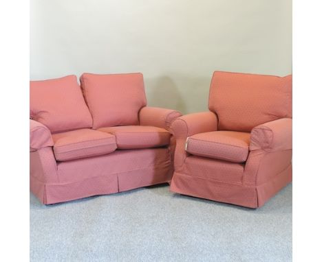 A Multiyork red upholstered two seater sofa, 136cm, together with a matching chair 