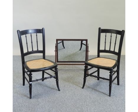 A pair of ebonised and cane seated children's chairs, together with a swing frame toiletry mirror, 44cm