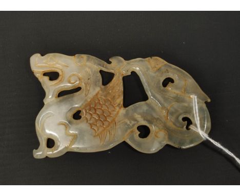 Chinese jade pierced and carved panel in the form of a dragon, 10cm long. 