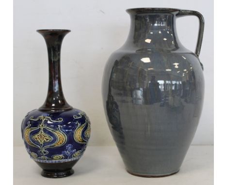 Doulton Lambeth stoneware vase of globe and shaft form with moulded entrelac foliate motifs and blue and brown glazes, impres