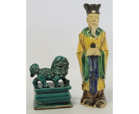 Chinese Shiwan pottery figure of a Daoist sage, standing with hands clasping a tablet, 20.5cm high; also a green glazed potte