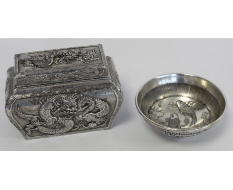 Chinese white metal small circular bowl with moulded decoration of carp in a pond, four character marks to interior and scrol
