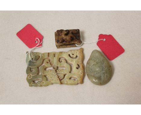 Three Chinese archaic and archaised jade carvings comprising; a green jade stone with a dragon relief, 5cm long, a pierced pl