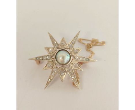 Star brooch / pendant with collet set half pearl and graduated rose diamonds in gold and silver, 7.2g. 