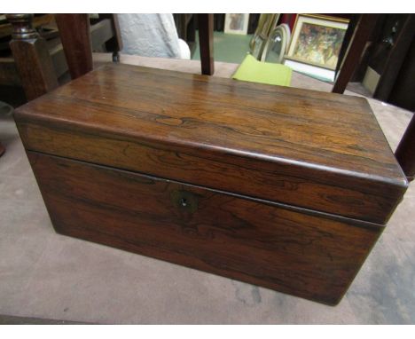 A Regency rosewood tea caddy with fitted interior and later glass inset mixing bowl