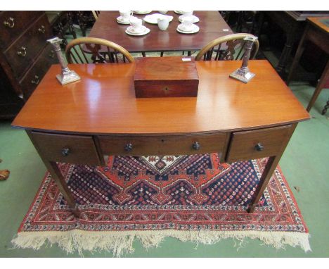 A Waring &amp; Gillow mahogany side table, single drawer flanked by two drawers, tapering legs, makers label to interior