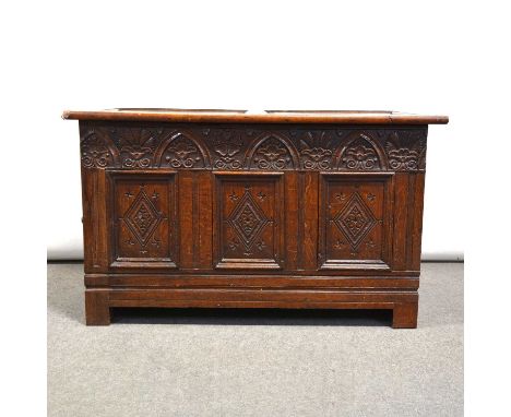 George III oak coffer, hinged lid with two panels, carved three panel front, width 124cm, depth 62cm, height 74cm.Condition r