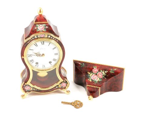 Modern red lacquered bracket clock, with bracket, Eluxa Swiss movement, 43cm overall.