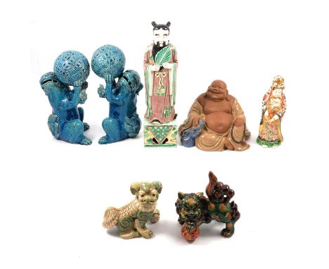 Pair of Chinese glazed pottery foo dogs, 24cm, two other smaller foo dog models, modern model of Buddha, man with a fan and a
