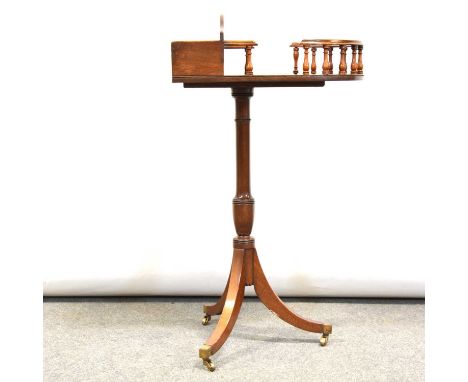 Mahogany tripod stationary stand, bowfront top with baize lined compartment and spindle gallery, turned column on three splay