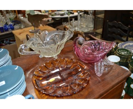 A ruby tinted glass cornucopia vase, an amber glass hors d'oeuvres dish and a moulded glass vase
