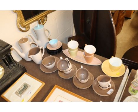 A quantity of various Poole pottery twin tone teaware