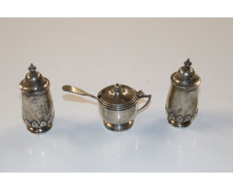 A silver three piece cruet