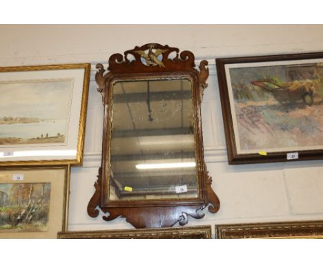 A mahogany fret carved wall  mirror in Chippendale style