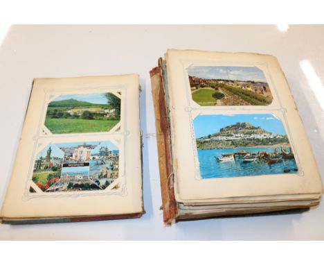 A vintage postcard album and contents