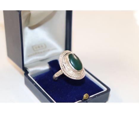 A large vintage silver and jade set ring, size ST