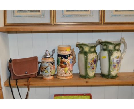A Kodak camera, two floral decorated jugs and two beer steins