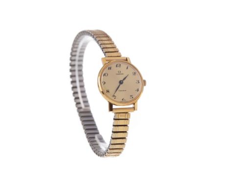 LADY'S OMEGA GOLD PLATED MANUAL WIND WRIST WATCH, the round gold coloured dial with Arabic hour markers, 23mm case, on an exp