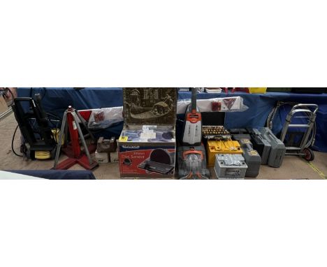 A collection of power tools together with a power washer, Large jack, weights, trailer bar, Vax, car batteries etc 