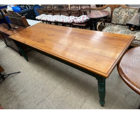 A large pine refectory table with a planked rectangular top on ring turned legs, 249cm x 91cm