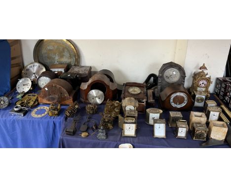 A 19th century gilt metal mantle clock together with a large quantity of clocks, clock parts etc 