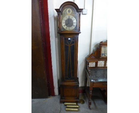 A George V oak triple weight longcase clock with Westminster, Whittington and St Michael chimes