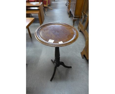 A Victorian mahogany tripod wine table