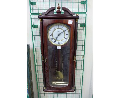 A Highlands mahogany wall clock