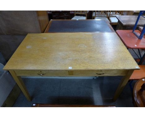 A light oak two drawer desk