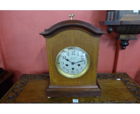 An early 20th Century Junghans inlaid mahogany bracket clock, retailed by Butcher & Swann, 9 Market St., Nottingham