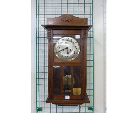 A mahogany wall clock