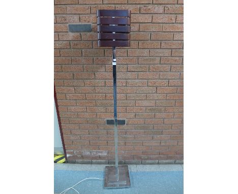 A 1970's chrome based teak standard lamp