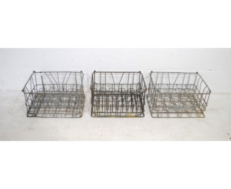 Three vintage metal bottle crates