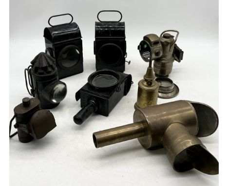 A collection of various vintage lamps including carriage lamps, railway, carbide etc.