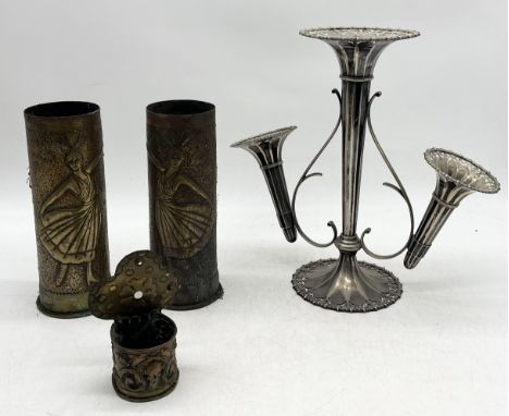 A pair of trench art shells decorated with Art Nouveau female figures along with a silver plated epergne etc.