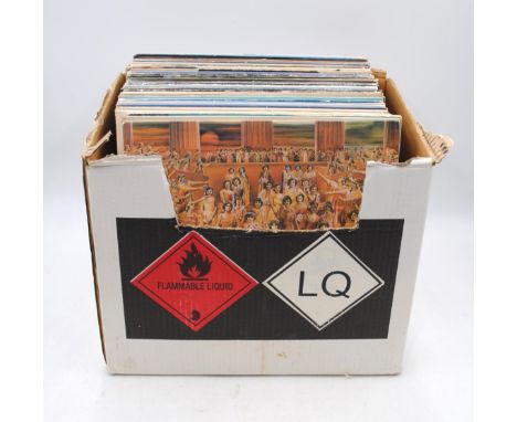 A quantity of various 12" vinyl records, including The Rolling Stones, The Beach Boys, Roxy Music, Santana, Bob Dylan, Camel,