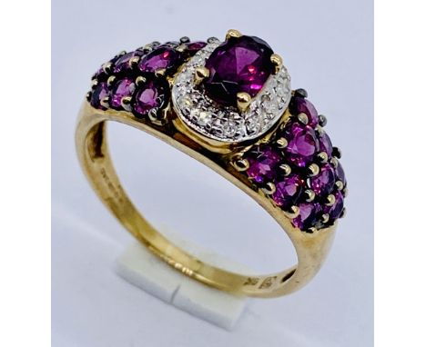 A garnet and diamond dress ring set in 9ct gold, size O 1/2