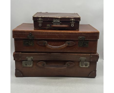 Three vintage leather suitcases (smallest in need of attention).