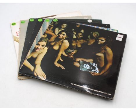 A collection of six 12" vinyl record albums by Jimi Hendrix, including 'Electric Ladyland', 'Band Of Gypsys', 'War Heroes', '