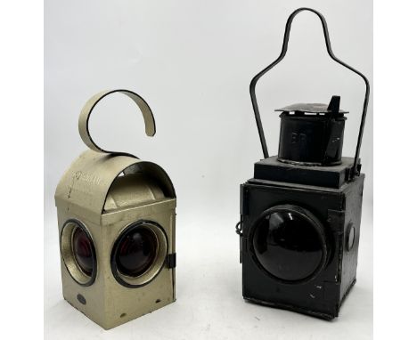 A vintage railway lantern marked for British Railways and the smaller road lamp marked Greenham